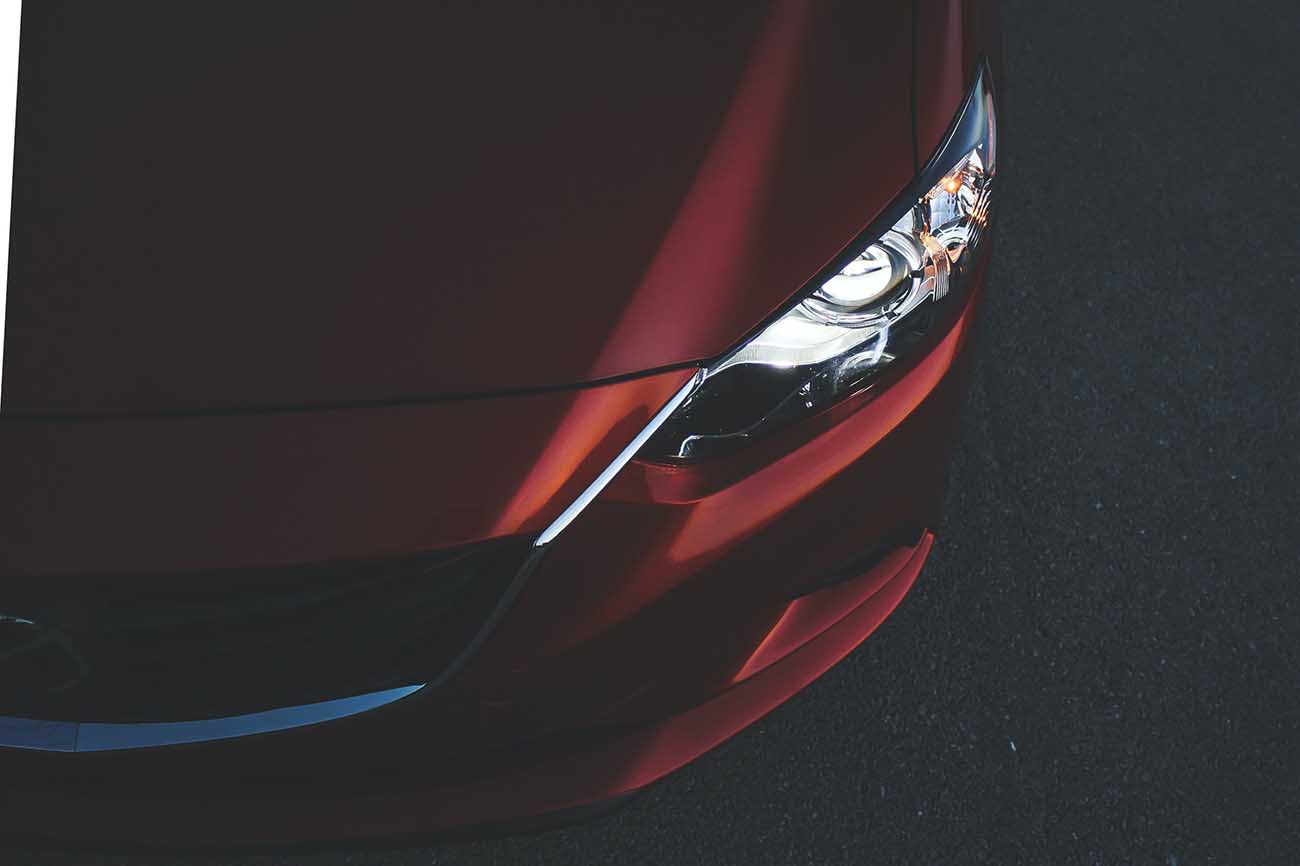Maroon Mazda 6 front end