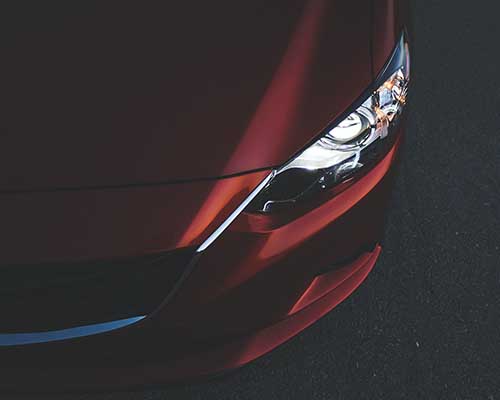 Maroon Mazda 6 front end